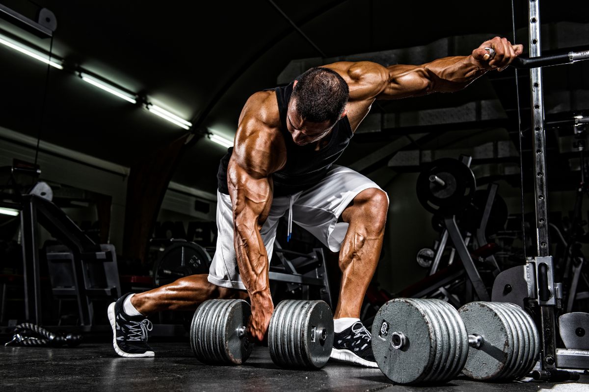 Image of a weightlifter lifting a dumbbell, emphasizing the benefits of using Nozey's Active Strips for high-intensity workouts. This image highlights the importance of being able to breathe easily during physical activity and the benefits of using Active Strips to support nasal breathing during high-intensity workouts.