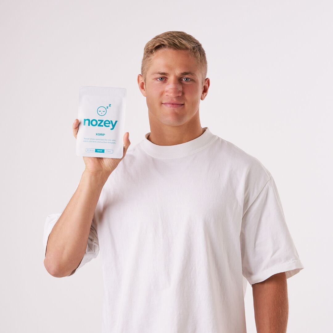 Nozey XGrip Strips held by a model
